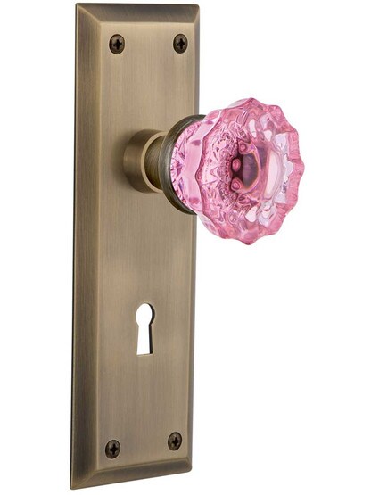 New York Door Set with Keyhole and Colored Fluted Crystal Glass Knobs Pink in Antique Brass.